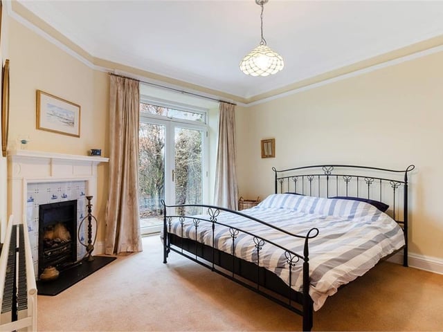 The master bedroom has French doors to the side garden.