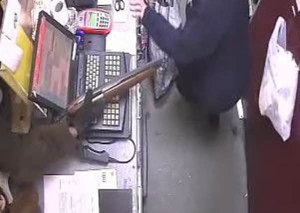 CCTV footage shows the saw-off shotgun used in the robbery