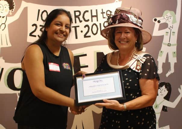 Nisha Vyas-Myall receives her award from Helen Nellis, Lord Lieutenant of Bedfordshire