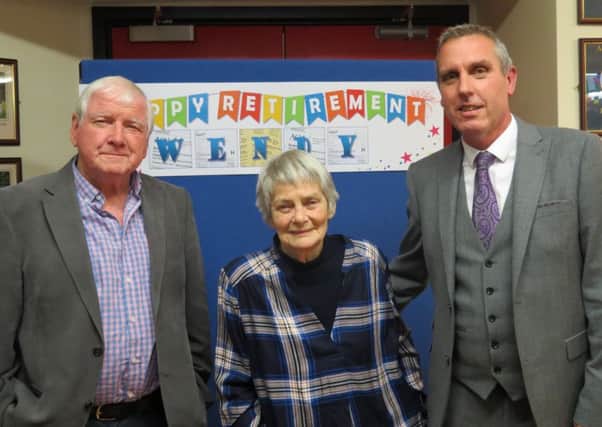 Retiring teacher Wendy Cooper with Gareth Davies and Head teacher
David Bailey, right.