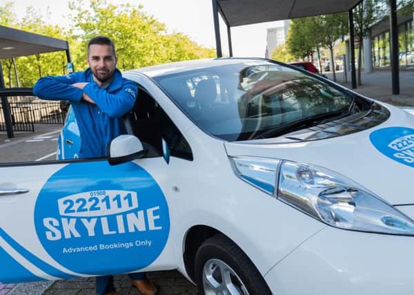 Skyline Taxis managing director Gav Sokhi with a Nissan Leaf taxi.