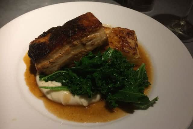 Slow-cooked pork belly, with wilted kale and dauphinoise potatoes