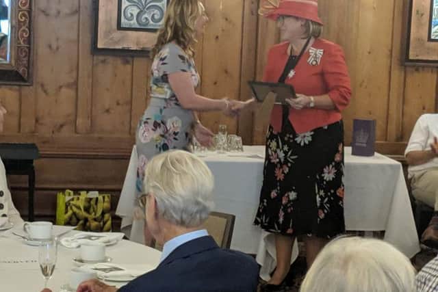 Julia Smith accepting the award from Lord Lieutenant of Bedfordshire Helen Nellis