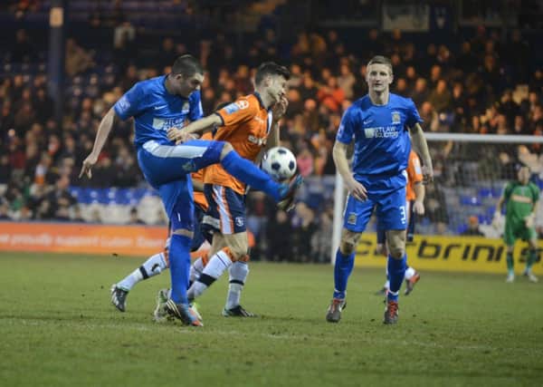 Town's fans watch on as Jonathan Smith tries to win the ball on Tuesday night
