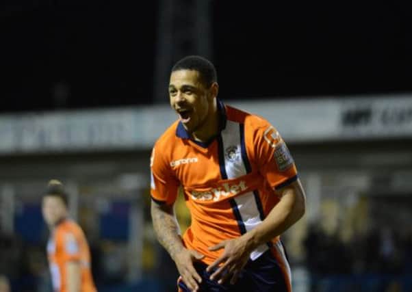 Andre Gray celebrates his second goal against Newport