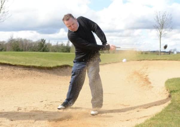 L13-457 Billy McAllister blind golfer being taught by Sam Smith at Bedford golf club. 
Bev CReagh
JR 17
18.4.13