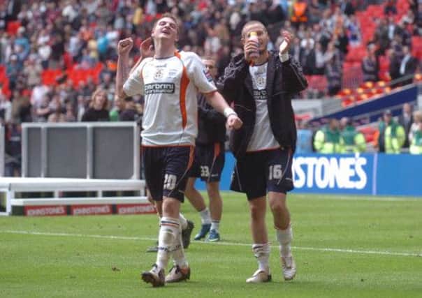Michael Spillane celebrates Luton's Johnstone's Paint Trophy win with Rossi Jarvis
