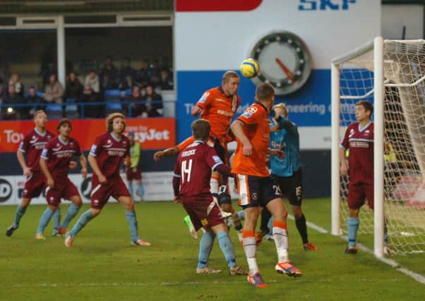 Scott Rendell heads home Town's equaliser in their FA Cup first round clash with Nuneaton