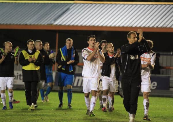 Town's players show their appreciation to the travelling fans at Braintree