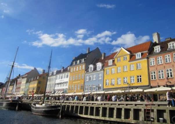A view of the colourful Nyhavn, a waterfront popular with tourists, Copenhagen, Denmark. Picture: PA Photo/Catherine Wylie.