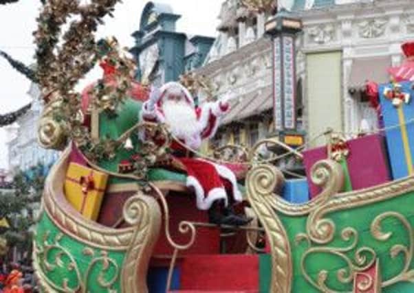 Santa on his sleigh at Disneyland Paris. Picture: PA Photo.
