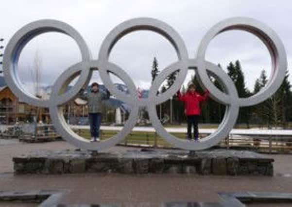 Teenagers Matt and Will pose for photos at the Whistler Olympic Village in Whistler, British Columbia, Canada. Picture: Hannah Stephenson/PA Photos.