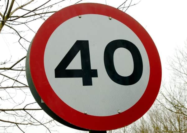 Speed limit sign.40 mph.
100203M-B396