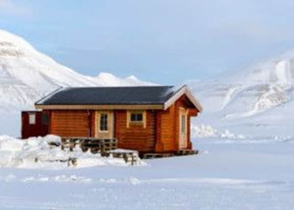 A trapper's hut in the remote Arctic landscape of Spitsbergen. Picture: PA Photo/Sarah Marshall.