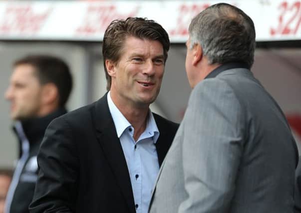 West Ham United's manager Sam Allardyce (right) and Swansea City's manager Michael Laudrup shake hands before the Barclays Premier League match at the Liberty Stadium, Swansea. PRESS ASSOCIATION Photo. Picture date: Saturday August 25, 2012. See PA story SOCCER Swansea. Photo credit should read: Nick Potts/PA Wire. RESTRICTIONS: Editorial use only. Maximum 45 images during a match. No video emulation or promotion as 'live'. No use in games, competitions, merchandise, betting or single club/player services. No use with unofficial audio, video, data, fixtures or club/league logos.
