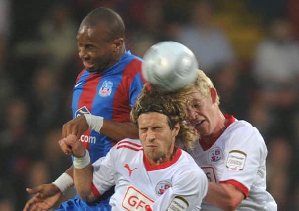 Crawley's Sergio Torres & Charlie Wassmer battle with Crystal  Palace's Calvin Andrew (Pic by Jon Rigby)