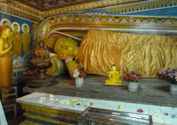 The reclining golden Buddha at the Gangaramaya Temple in Colombo.