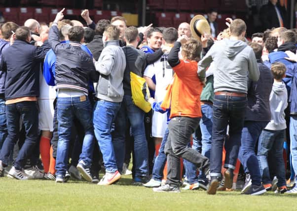 Town's supporters join the players' post match huddle