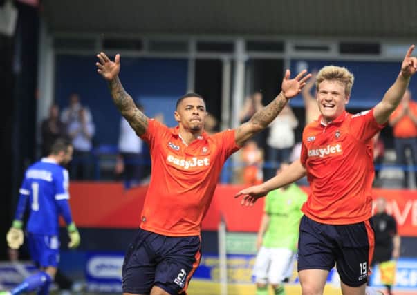 Andre Gray celebrates scoring from the penalty spot