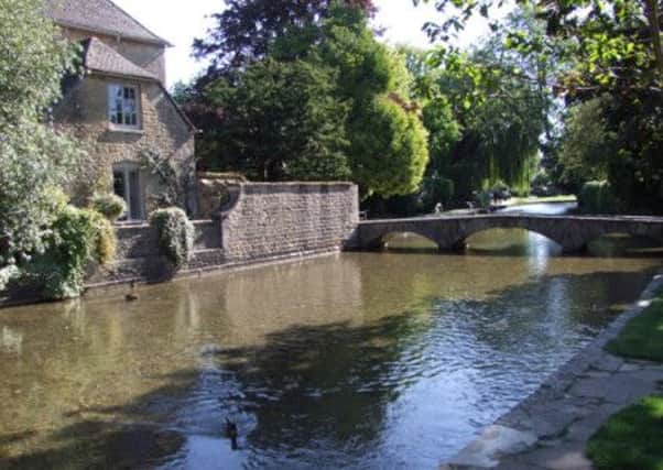 The tranquil setting of Bourton-on-the-Water. Picture: Alan Wooding