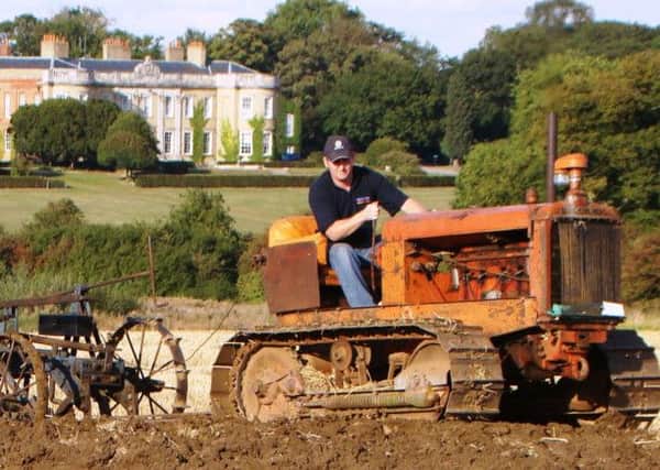 Andrew Walker on his 1942 Allis Chalmers M Crawler PNL-140918-094944001