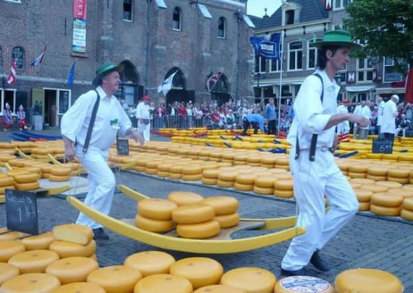 The traditional Alkmaar cheese market in operation in full swing.