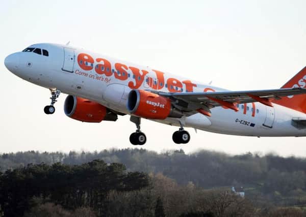File photo dated 21/04/10 of a plane of the budget airline easyJet, as beleaguered holiday firm Thomas Cook has reportedly signed a deal to book thousands of seats on flights run by low-cost carrier easyJet. PRESS ASSOCIATION Photo. Issue date date: Sunday September 9, 2012. See PA story CITY Thomas Cook. Photo credit should read: Barry Batchelor/PA Wire ENGEMN00120121009090959