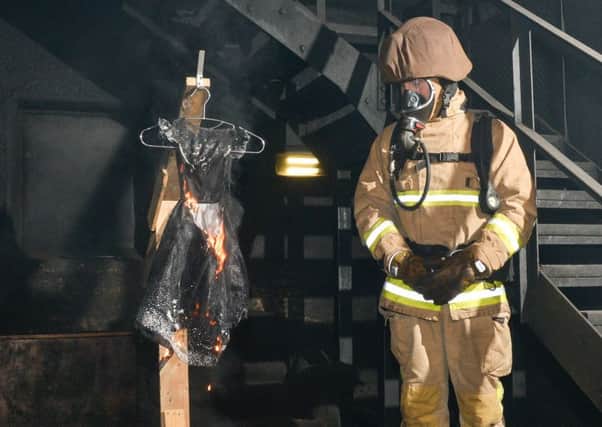 Halloween fire awarness. Firefighters set alight to Halloween costumes to show how fasat they go up in flames.