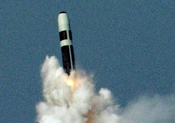 A Trident II D5 missile is fired from HM Submarine Vanguard during tests in the Western Atlantic in 2005.

A credible nuclear deterrent depends upon the ability to threaten an assured and effective response to aggression. The Trident II D5 missile has a range of over 4,000 nautical miles and an accuracy, which can be measured in metres. 

Each missile is technically capable of delivering up to 12 warheads, enabling a number of different targets to be engaged, and each Vanguard class submarine has 16 missile tubes. The missile is ejected from the submarine by high-pressure gas and only when it reaches the surface does the rocket system actually fire. PPP-151230-133318001