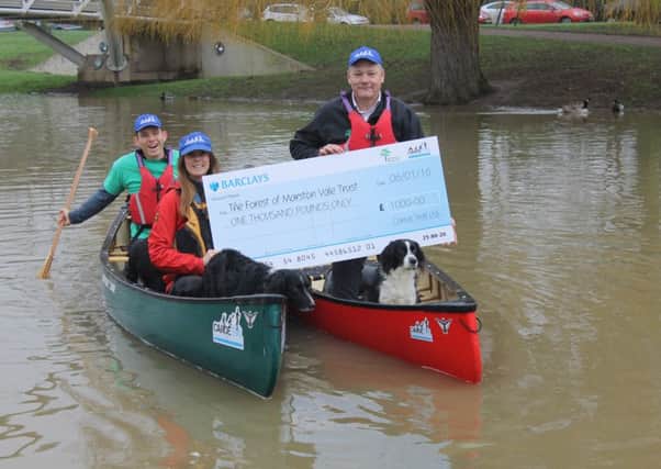 Richard & Ashley Kenlock-Harpham presenting the cheque to  Forest of Marston Vale CEO, Nick Webb at The Bedford Embankment
