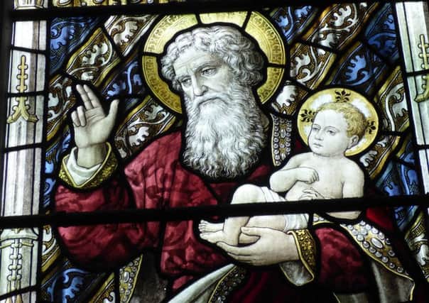 Window at St Paul's Church, Bedford, showing Simeon holding Jesus.