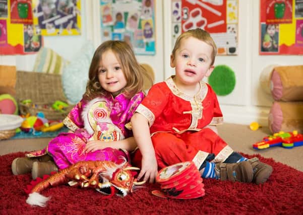 Chinese New Year at Cherry Trees Day Nursery - Eliza Hartley and Adam Webb, aged 2. PNL-160802-153042001