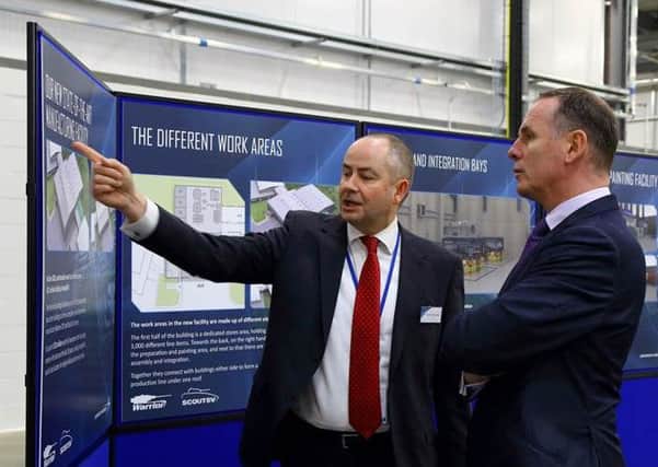 Graham Harraway, Director of Operations at Lockheed Martin UK Ampthill takes Tony Douglas, Chief Executive of DE&S, through plans for the interior of the new manufacturing facility. PNL-160802-122359001