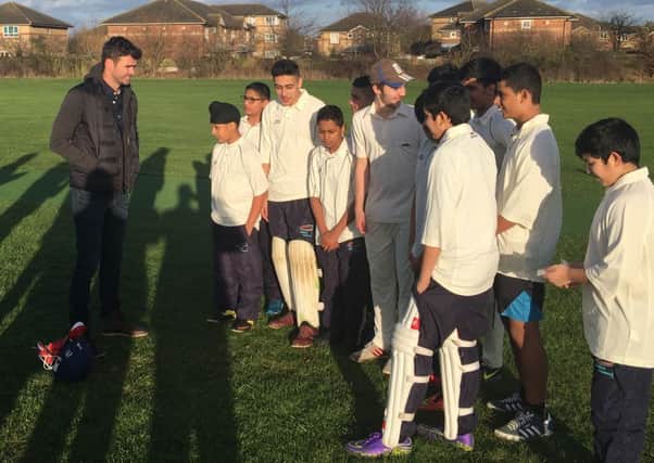 Jimmy Anderson, left, with pupils from Bedford Academy