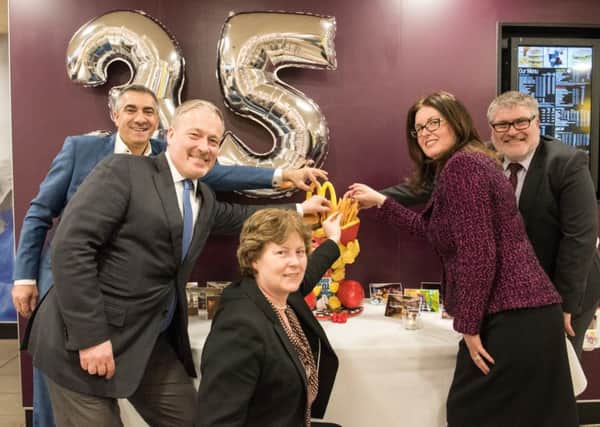 McDonalds franchisee Ismail Anilmis celebrates 35 years with Richard Fuller MP, Mayor Dave Hodgson and members of Bedford BID PNL-160216-163045001