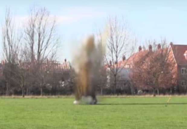 Police carry out controlled explosion after hand grenade is handed in to the station