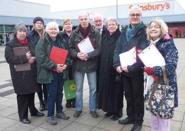 Councillor James Valentine and supporters collect signatures on a petition to regenerate the Saxon Centre, Kempston PNL-160224-134052001