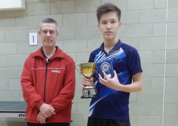 Bedford Table Tennis League chairman Dave Beddall with men's singles winner Kuanyshev Chingis