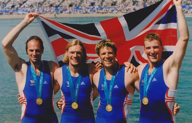 Tim Foster receiving his medal with Sir Steve Redgrave, James Cracknell and Matthew Pinsent.