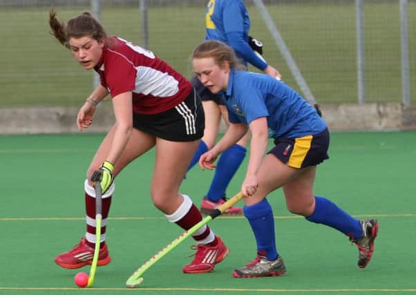 Martha Haslam of Bedford reaches for the ball against Emma Baxter of Blueharts. Picture (c) Pete Rattu