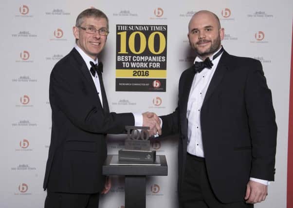 Alex Ford, operations director at Oakman Inns, receiving the Sunday Times Best Companies to Work For 2016 Award from Glenn Dimelow, director of Best Companies, last week.