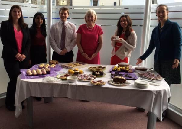 Staff at Emmott Snell solicitors raised more than Â£200 for the Eastern Legal Support Trust from a cake sale