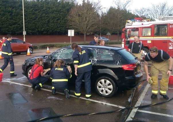 Firefighters from Kempston Community Fire Station raised over Â£200 at their Charity Car Wash on Saturday 12 March, 2016 PNL-160314-125012001