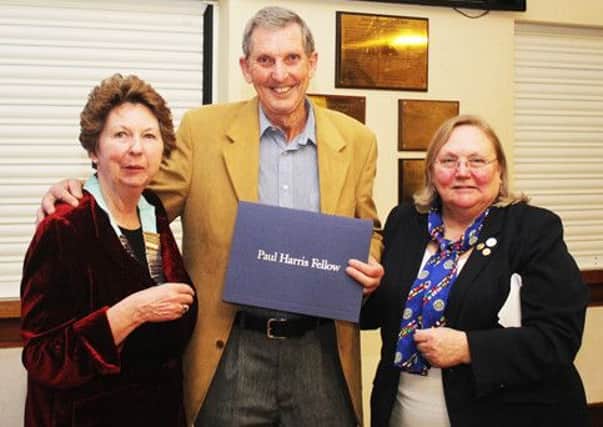 Harold Darbon receives the Paul Harris Fellowship from Prue Dixon (left) and Debbie Hodge
