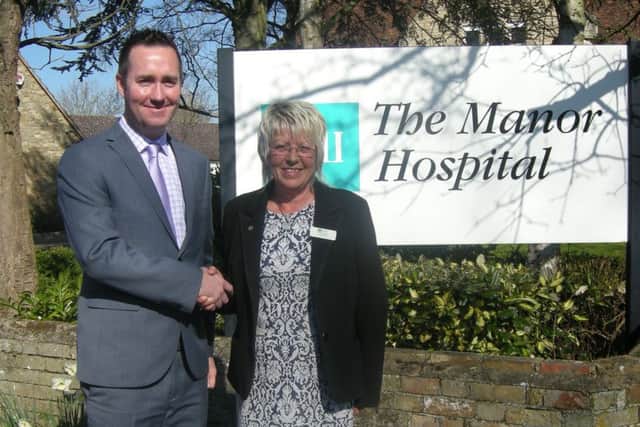 Anne McGregor hands over to Adrian Brady at BMI Manor Hospital, Biddenham. PNL-160404-141634001
