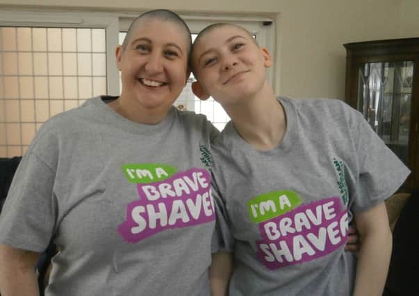Beverley Rode and Lauren McBride head shave.