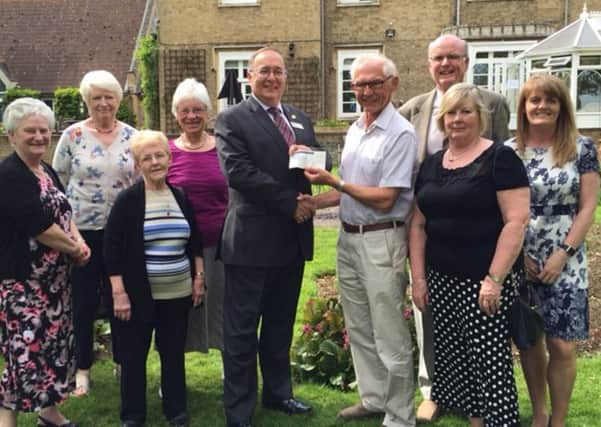 Befrienders donation to St John's Hospice - Picture Left to right (back row) Ruth Presley, Pat Parkinson, Rita Beaumont, Mike Coward  St Johns, 
Gordon Beeden, Colin Albon (front row) Rosemary Albon, Pauline Panter and Tracy Haddock  St Johns