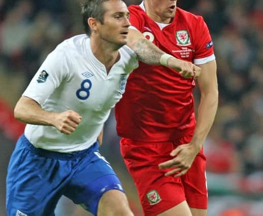 Frank Lampard of England and Jack Collison of Wales. PNL-160526-094958002