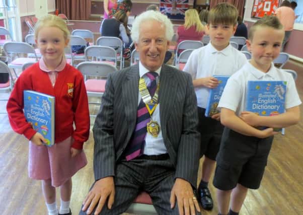 President of Rotary Club of Bedford Michael Lennox with pupils at Milton Ernest Lower School who have all been presented with Dictionaries 4 Life