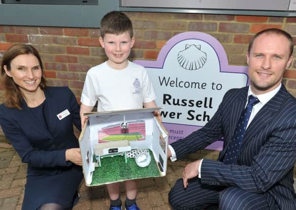 Russell Lower School pupil George Beck with his winning bedroom design, with Head Teacher Nicki Walker and Bloor Homes Sales Manager Luke Southgate